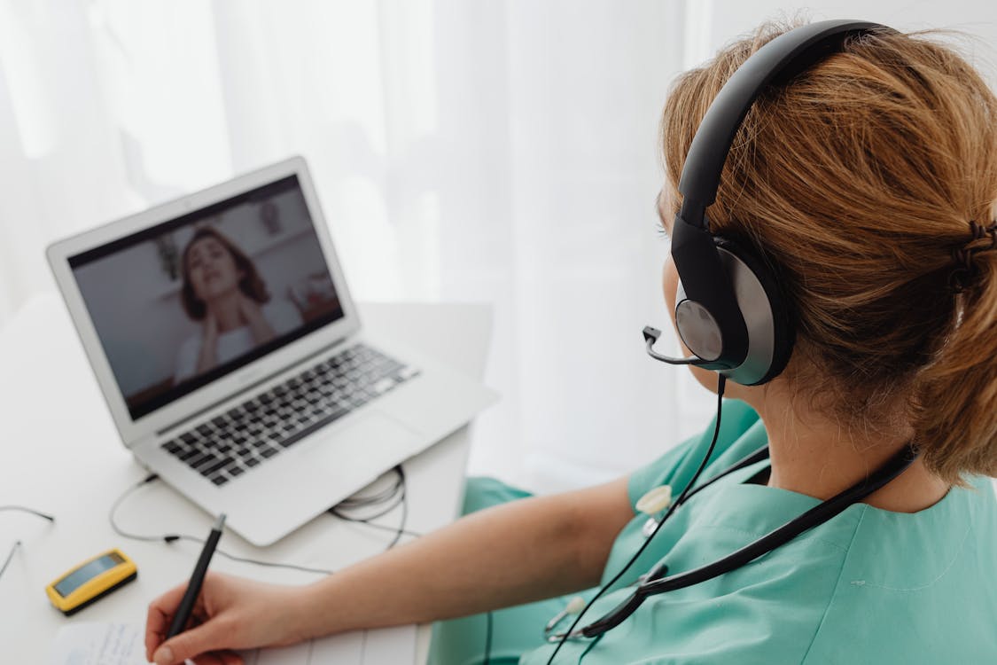 Woman reviewing saas automation on a laptop